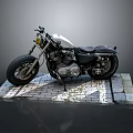 Classic Silver and Black Motorcycle with Large Tires on Brick Platform